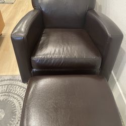 2 faux leather chairs and ottoman