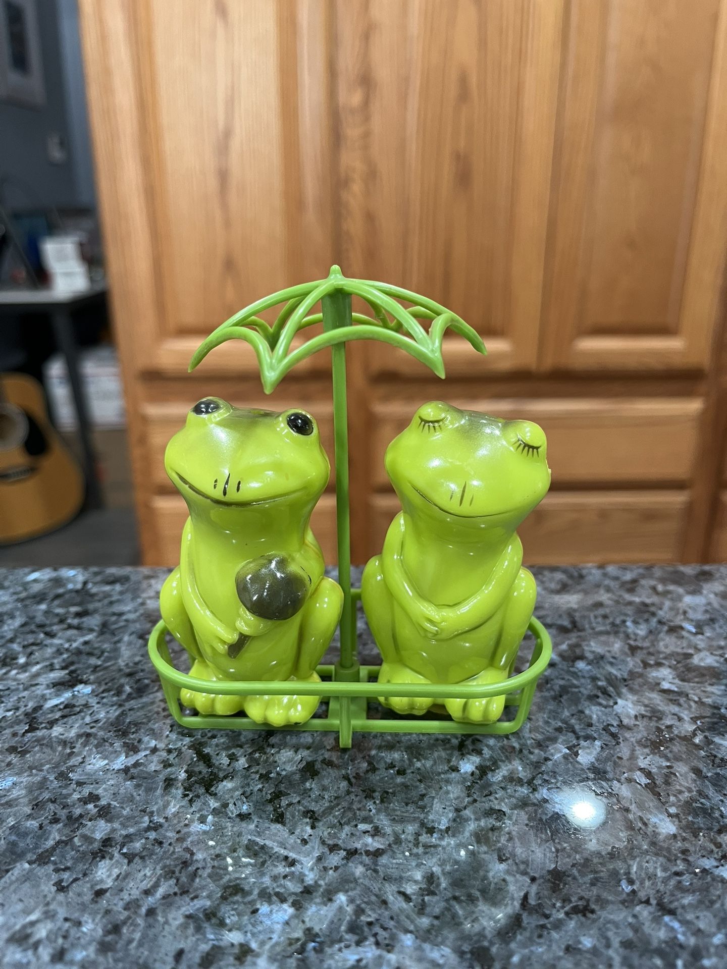 Vintage 1950’s Plastic Frogs Under Umbrella Pair of Salt and Pepper Shakers. Preowned never used. Has been on display in a cabinet with a very large