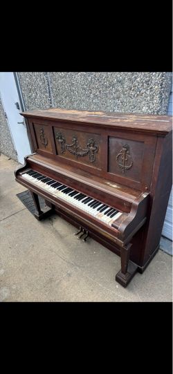 Antique Upright Piano with Ornate Wood Cabinet
