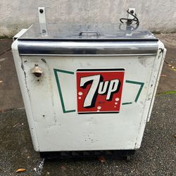 7-up memorabilia collection, chest cooler, clock, trashcan.   The chest cooler turns on and cools down.  It comes with a bottle, cap remover and colle