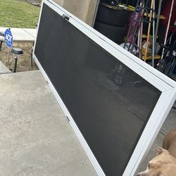Storm protection screen door