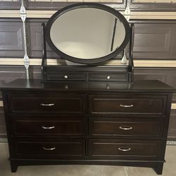Dark brown Wood dresser with ovel filp mirror
