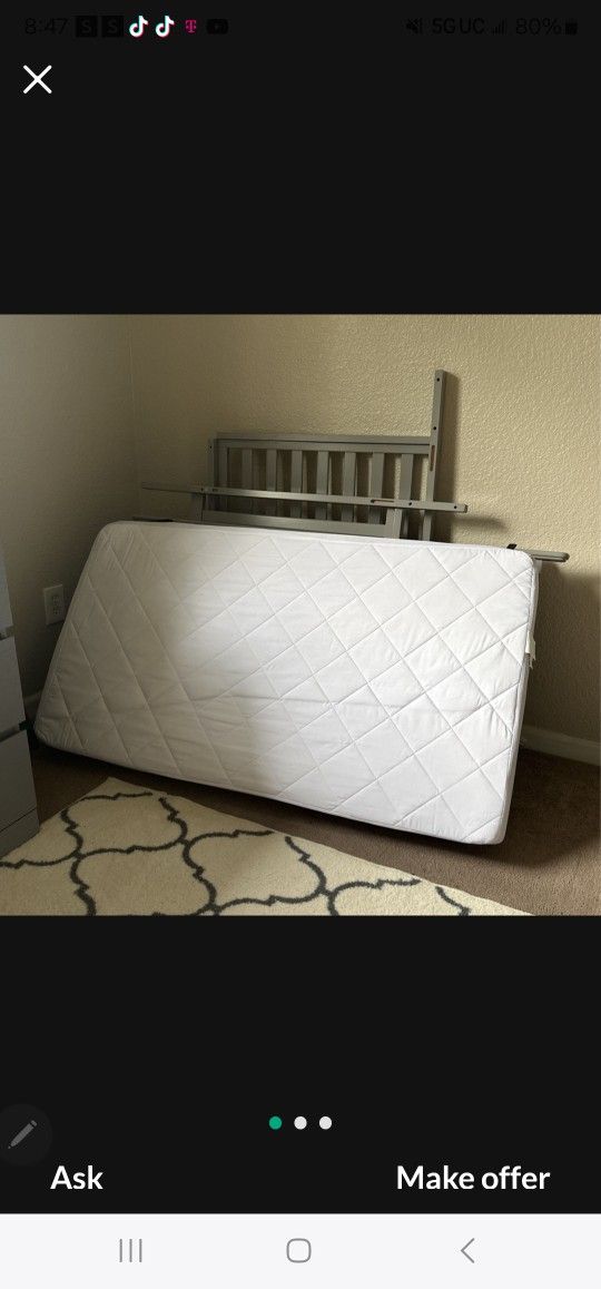 Crib mattress almost new with protection sheet on it 