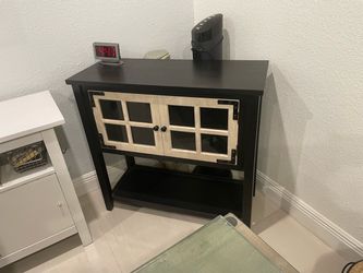 Black Wood Cabinet with Glass Panel Doors: h:33”; d:14”;l:34”