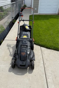 BLACK AND DECKER BATTERY LAWNMOWER IN DECENT CONDITION.  IT INCLUDES WHAT YOU SEE IN THE PICTURES. $100,00 OR BEST OFFER.