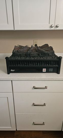 Faux electric logs with heater