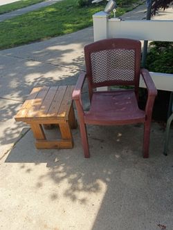 Outdoor burgundy vinyl chair with wooden table