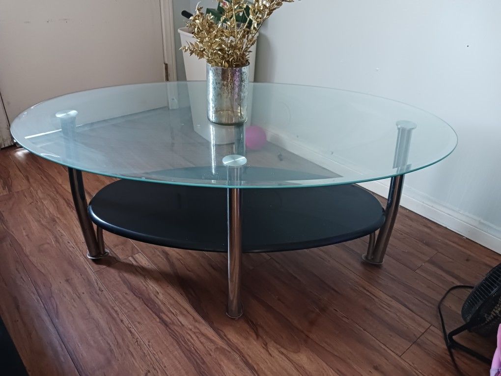 Glass coffee table for the living room. It is used $40.