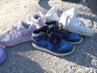 Three pairs of used nikes