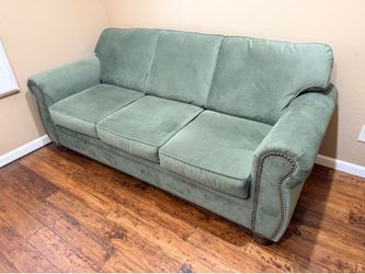 Green studded sofa sleeper couch