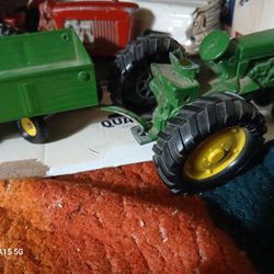 add or separated ERTL (John deere) tractor and hay hauler  