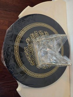 Arabic calligraphy in a premium gold finish on a classic black background.