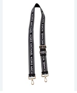 Michael Kors Jet Set Travel logo strap features a black and white web design with gold-tone hardware