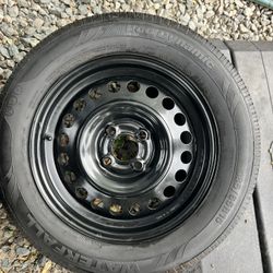 15” nissan Versa wheel and tire 4x100mm