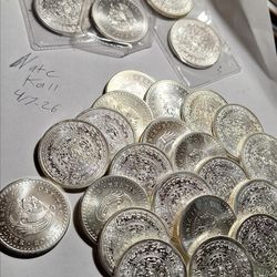 27 1oz  silver Aztec bullion rounds.