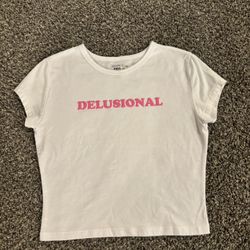 White crop top with pink “Delusional” text 