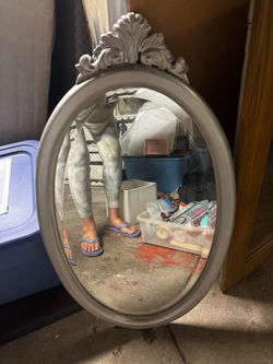 Oval Wall Mirror with Ornate Crown Detail