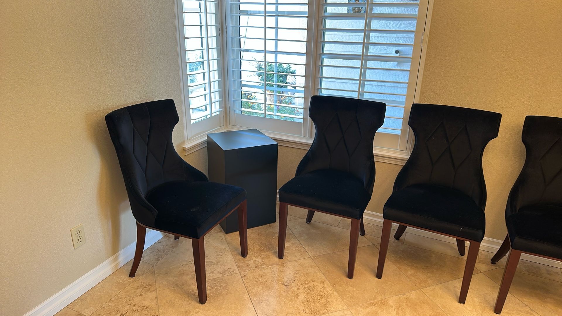 Four Black Dining Chairs.