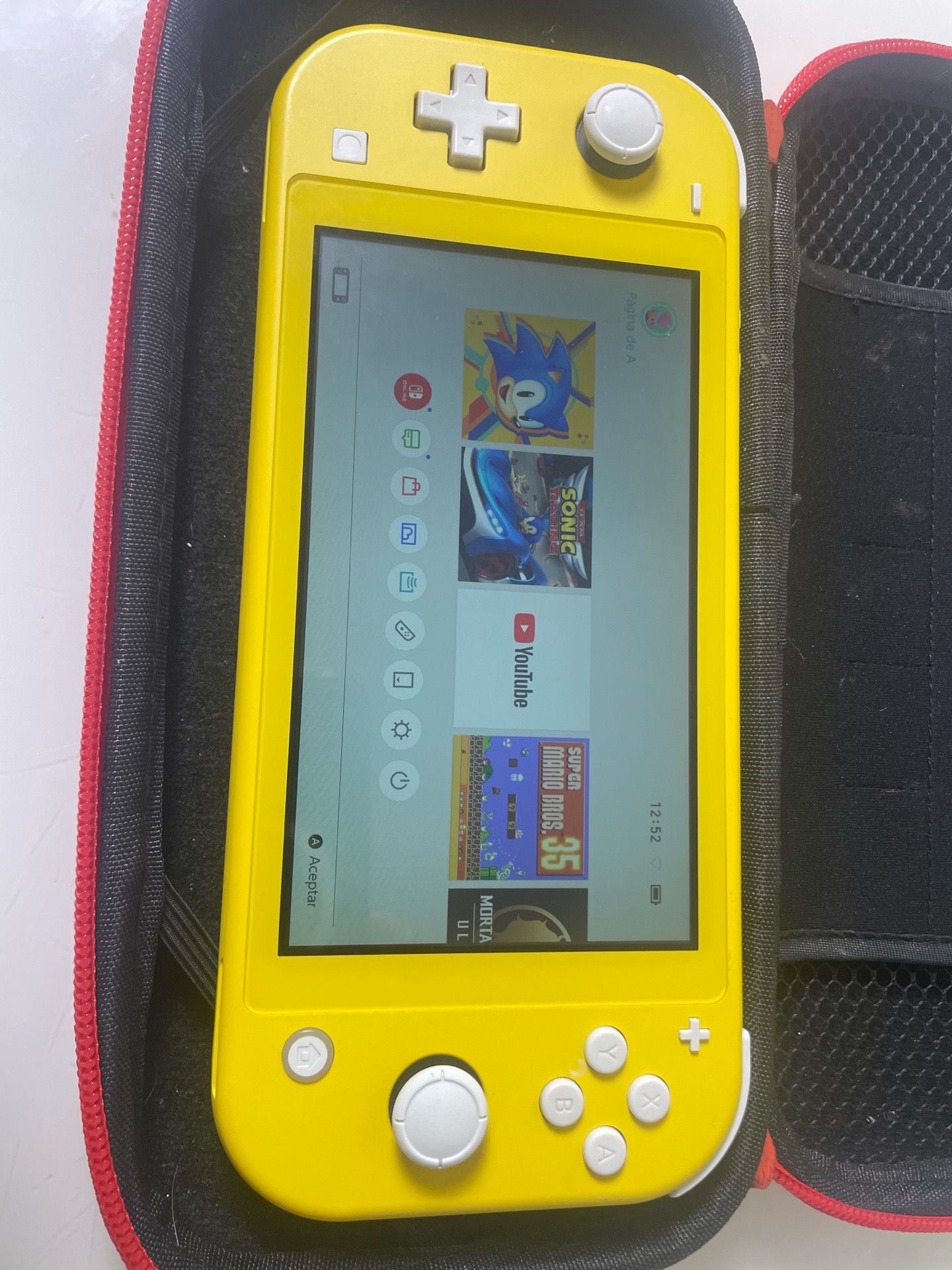 Nintendo Switch Lite Yellow- Console + 128gb micro sd card + 2 games