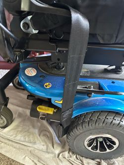 Motorized  wheelchair scooter for mobile barriers