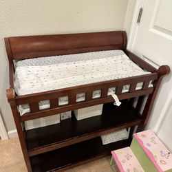 Brown Diaper Changer Table with Changing Pad, Cover, and Storage - Convenient and Comfortable!