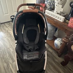 Stroller with car seat and a walker.
