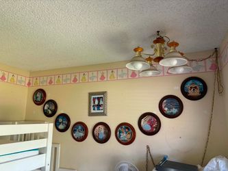 9 Cinderella collector plates, framed