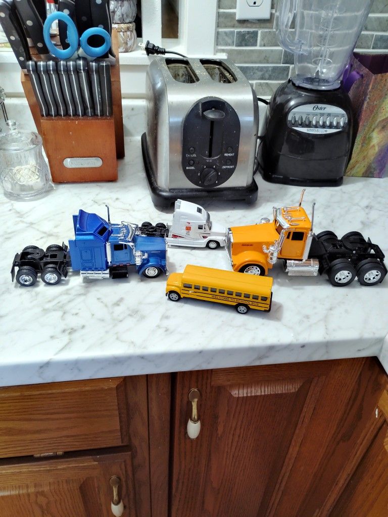 2 Kenworth Truck's And A Schopl Bus And Simply Truck.