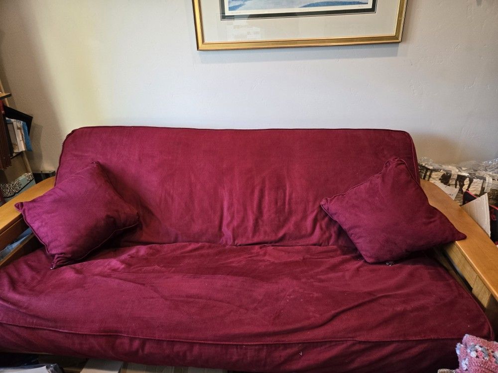 Queensize Hidabed With All Red Cover And Pillows