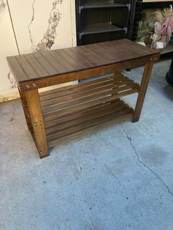 The new shoe bench is made of wood.