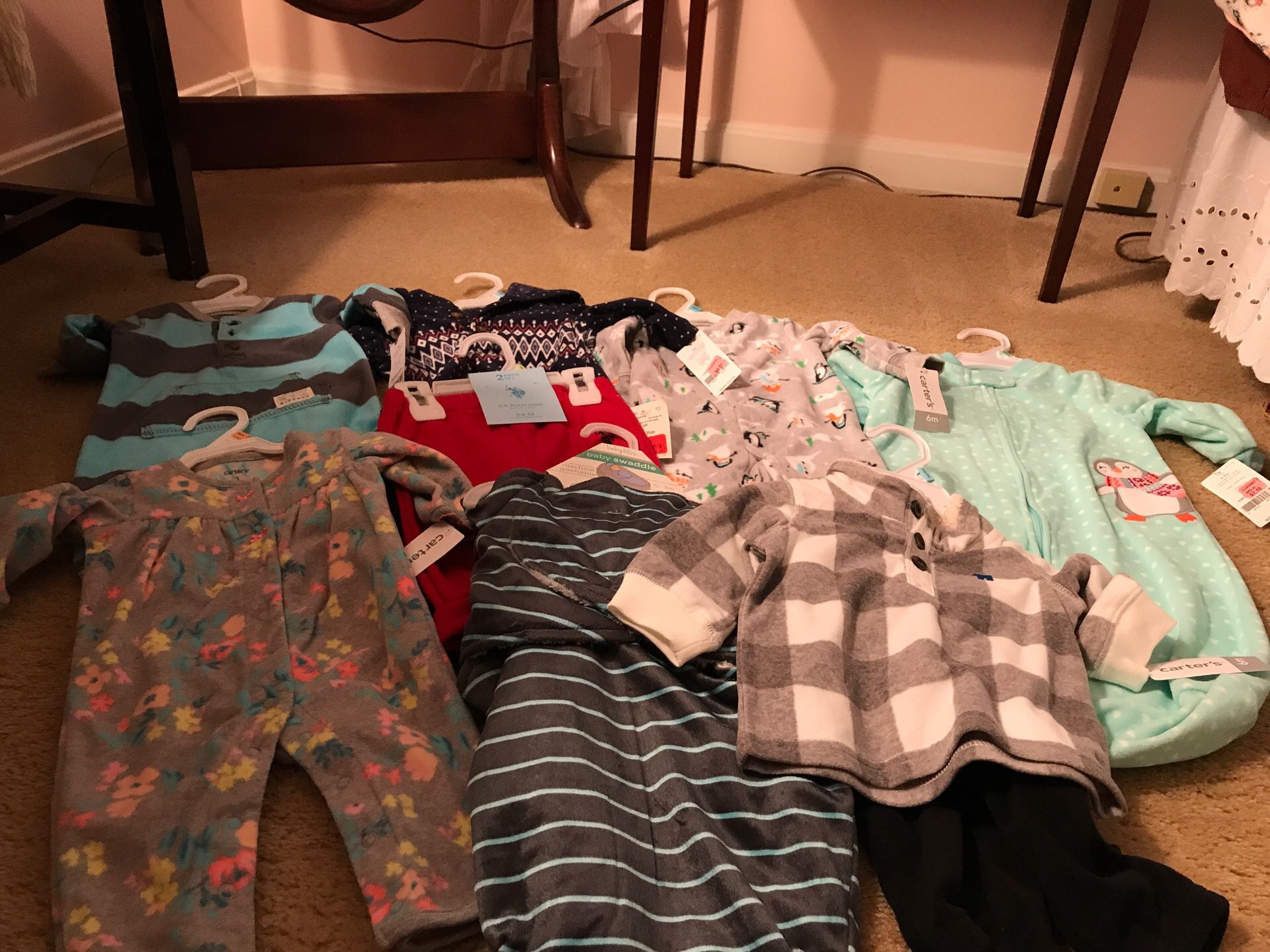 Variety of new baby clothes