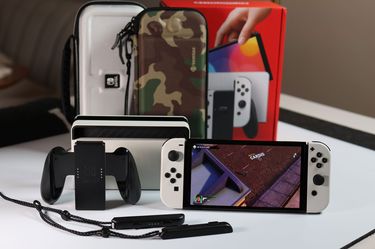 Nintendo Switch OLED White Bundle – 400GB SD Card + 2 Cases