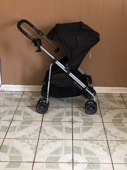 PRACTICALLY NEW EVENFLO REVERSI STROLLER AND BASSINET!!!!