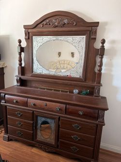 Ornate wood dresser with mirror