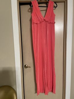 Beautiful brand new women’s size large dressy romper. Coral color. Tags still on. 