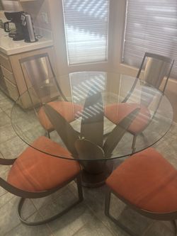 Glass Table And Red Chairs