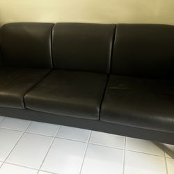 Black leather sofa + matching chair with wood frame. 