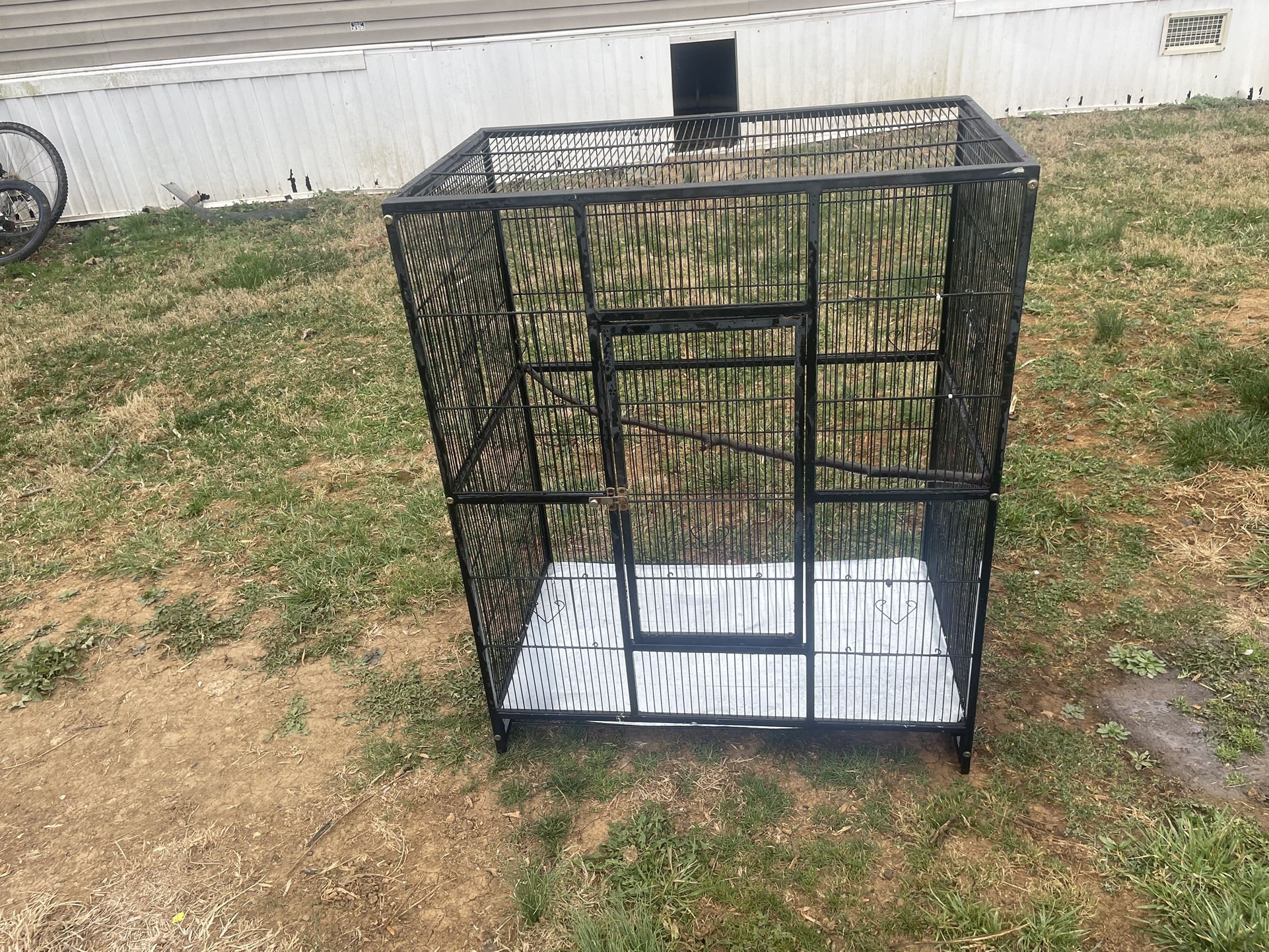 Bird cage measures 32" long, 19" wide, and 38" high