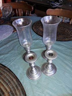 4 candle holders small and big.