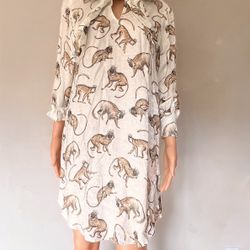 Size 2 charming white dress featuring a delightful monkey print