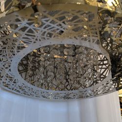 Beautiful chromed out chandelier with dangling beads
Measures 8 in high 15 in in diameter