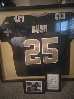 Authentic hand signed Reggie bush professional framed Jersey with certificate of authenticity and picture of signing