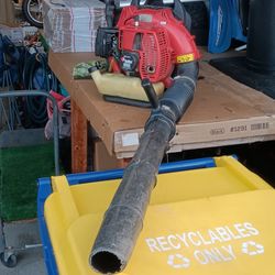 $200 with trade-in or $275. Powerful RedMax EB4401 gas-powered backpack leaf blower. This unit has a red engine housing with a black blower tube and a