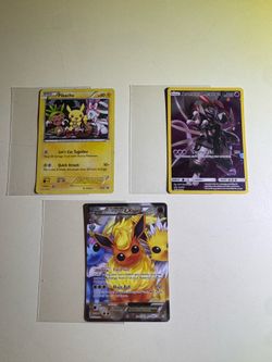 Rare 2016 and 2019 Pokemon cards: Full Art Flareon EX, Holofoil Picnic Pikachu, and Armored Mewtwo