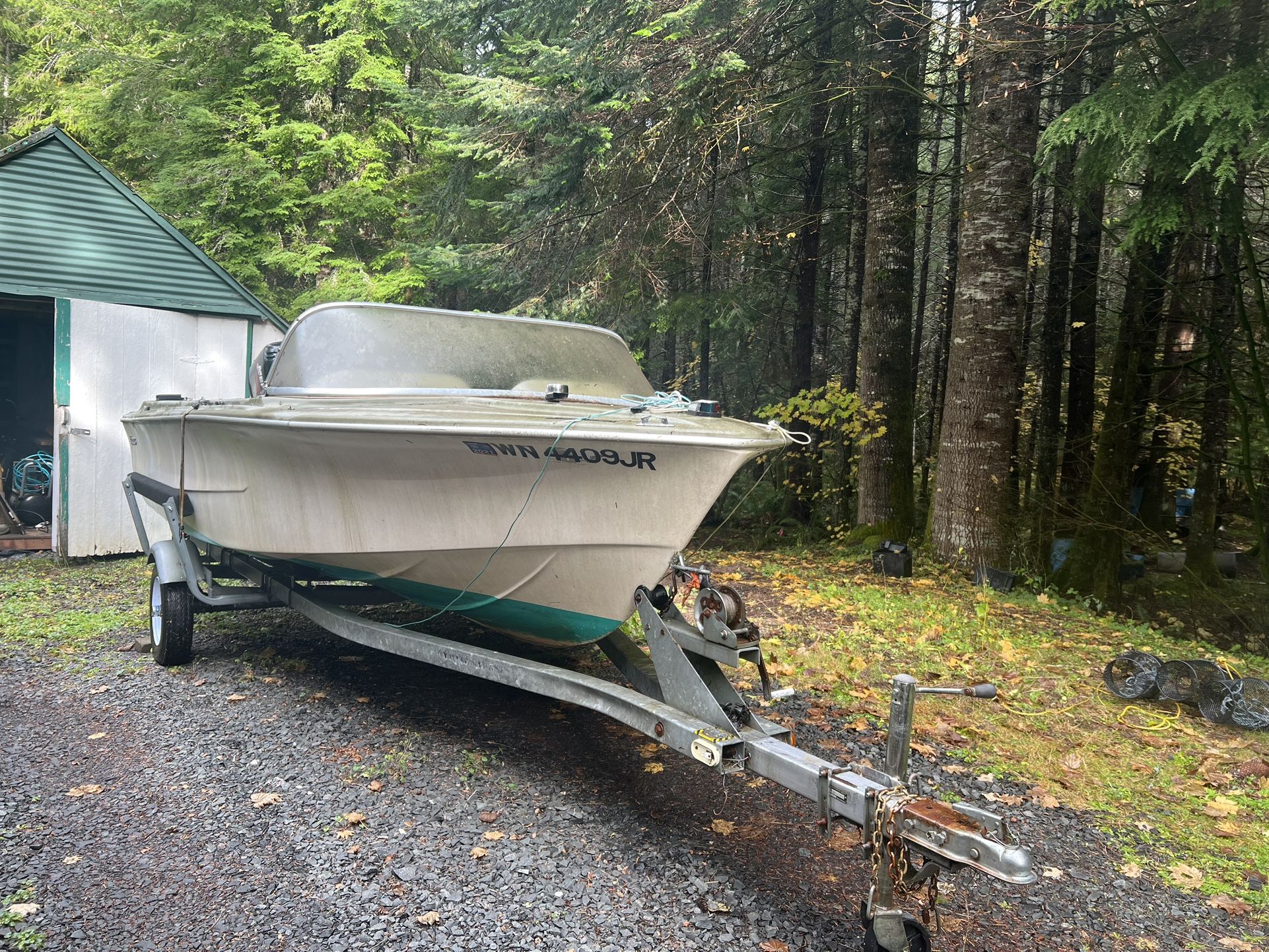 Boat motor and trailer for sale