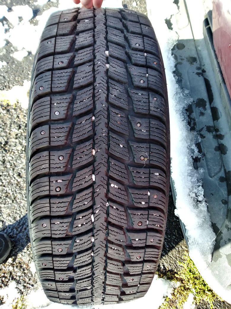 4 almost new studded snow tires