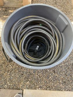 Trash Can And Garden Hoses