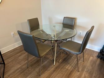 Round Glass Dining Table with 4 matching chairs (Ashley’s Furniture)