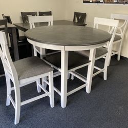 5pc Gray & White  Pub Table Set includes round wood table and 4 matching upholstered chairs. 