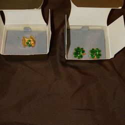 A brooch And Earrings With The Original boxes